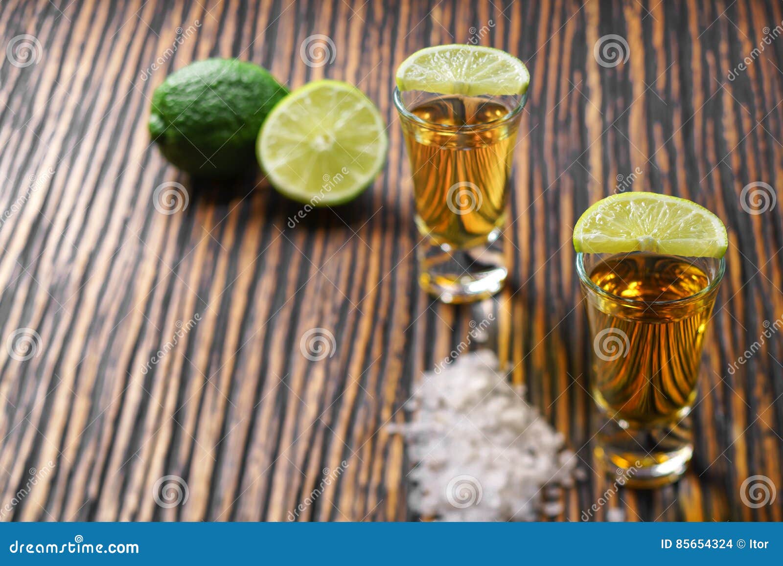 Two Shot of Gold Tequila on a Brown Wooden Background ,selectiv Stock ...