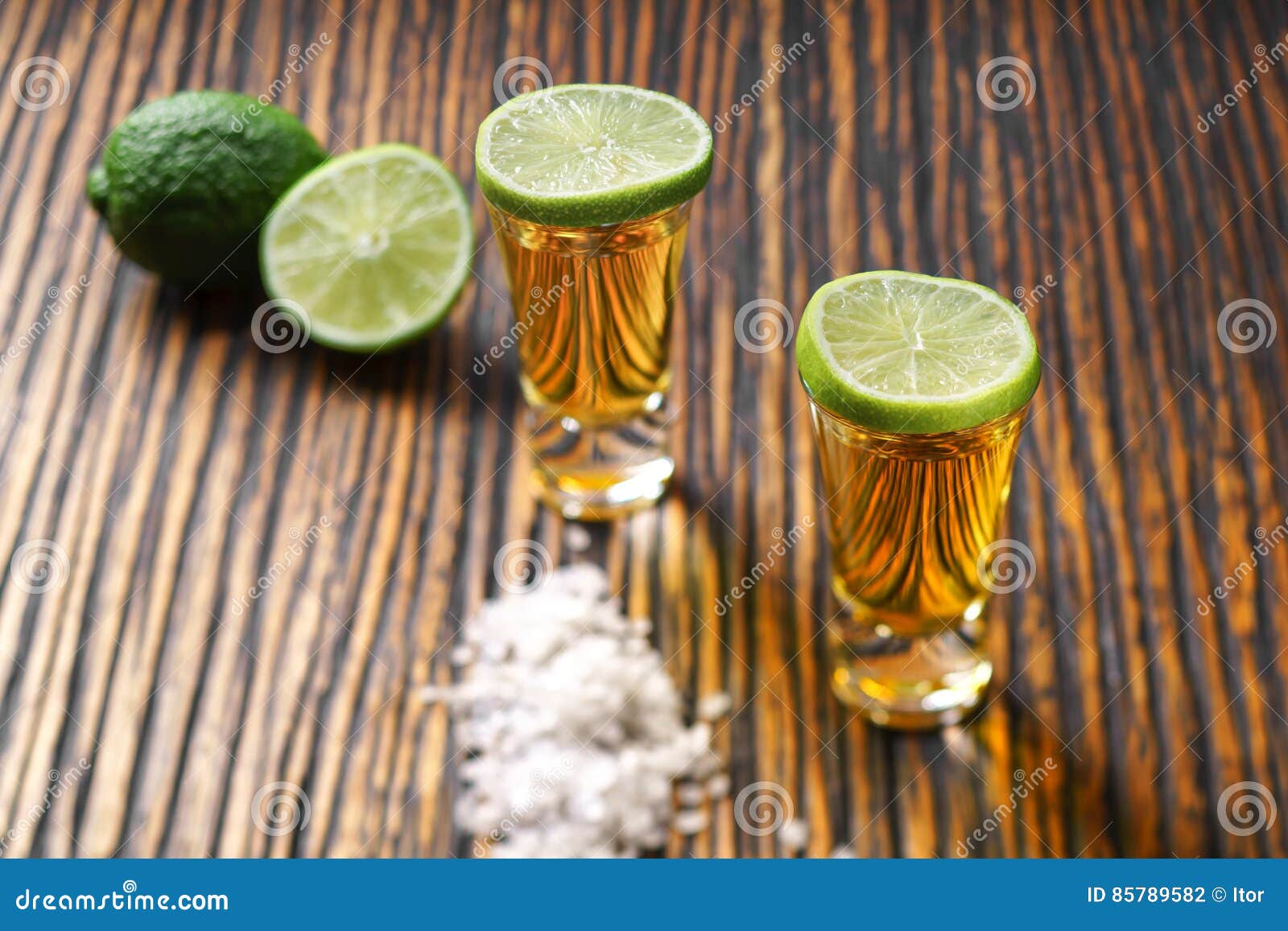 Two Shot of Gold Tequila on a Brown Wooden Background ,selectiv Stock ...