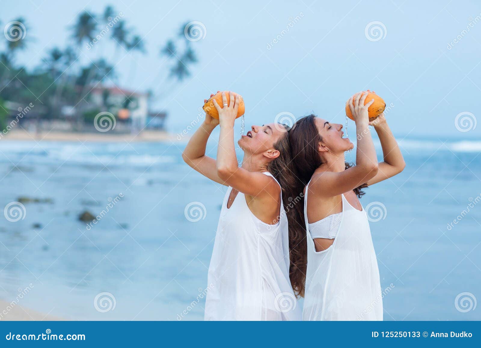 Two Sisters Having Fun At The Sea At The Sunset Stock 