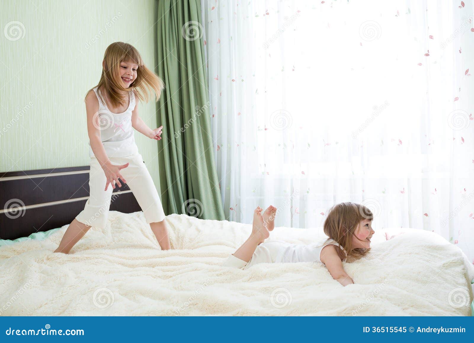 Two Sisters Playing On Bed Stock Image Image Of Playing 36515545