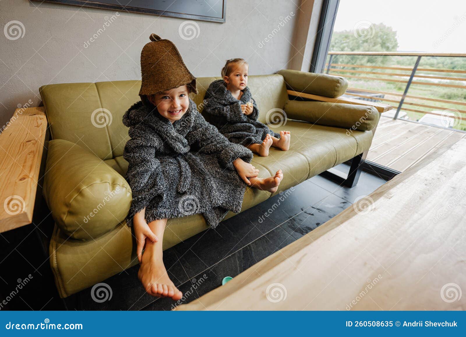 Beauty, healthcare. baby Boy relaxing in the sauna Toddler with broom and  hat in russian sauna or bath Stock Photo