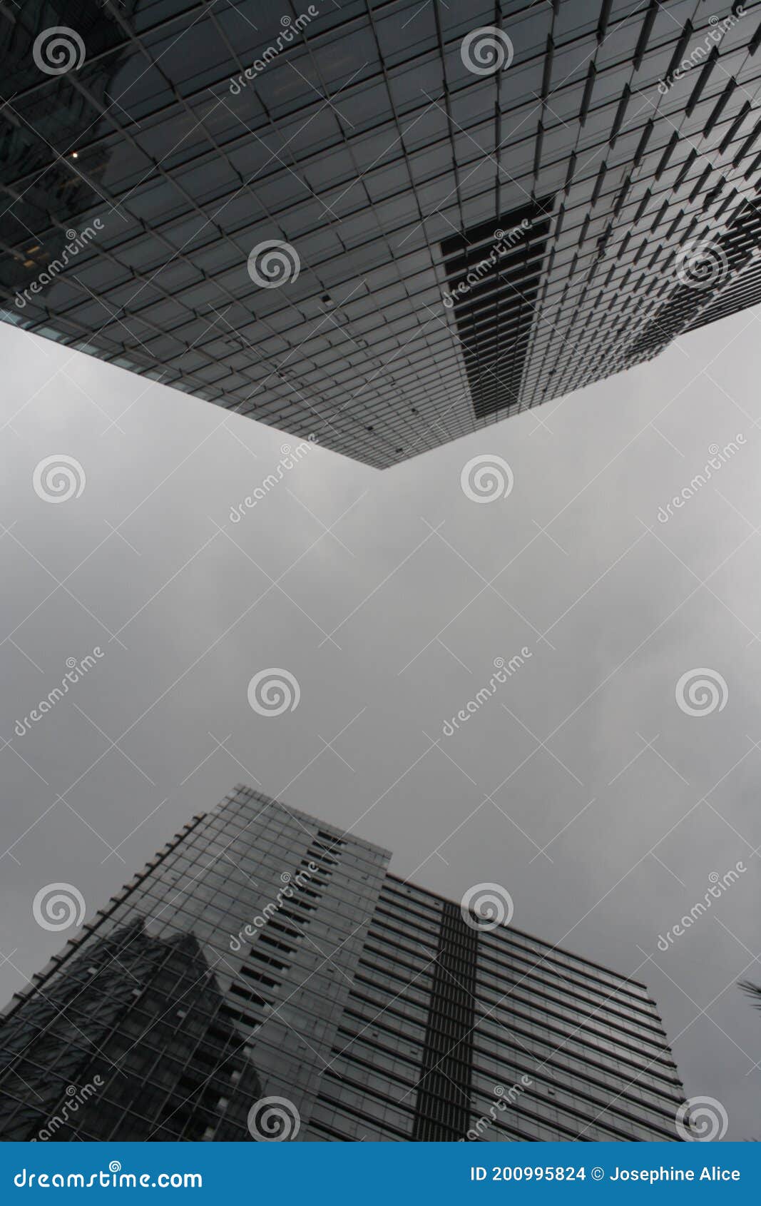two skyscrappers on a cloudy day
