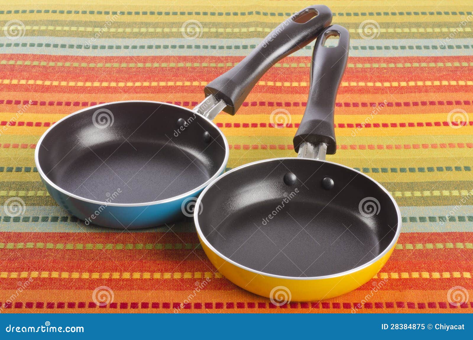 Two Small Frying Pans 1 stock image. Image of cloth 28384875