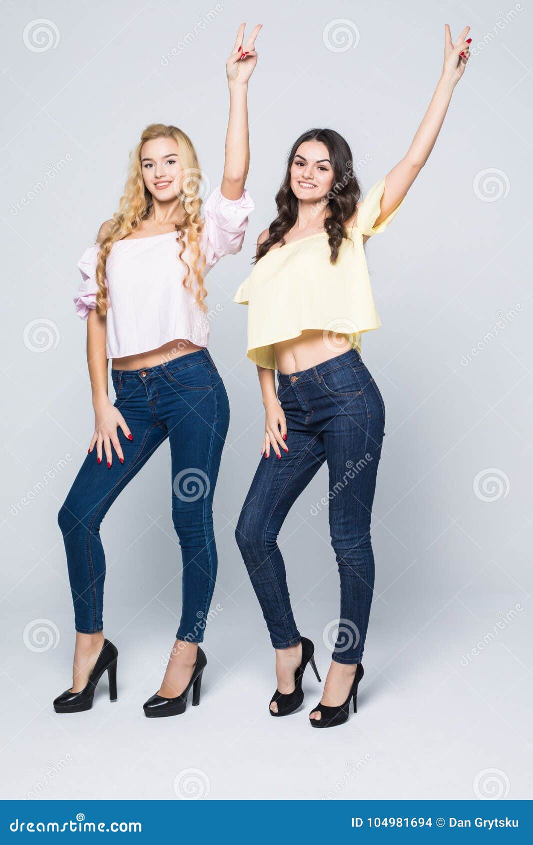 Two Smiling Attractive Girl Friends Blond and Brunette Posing Happy on ...