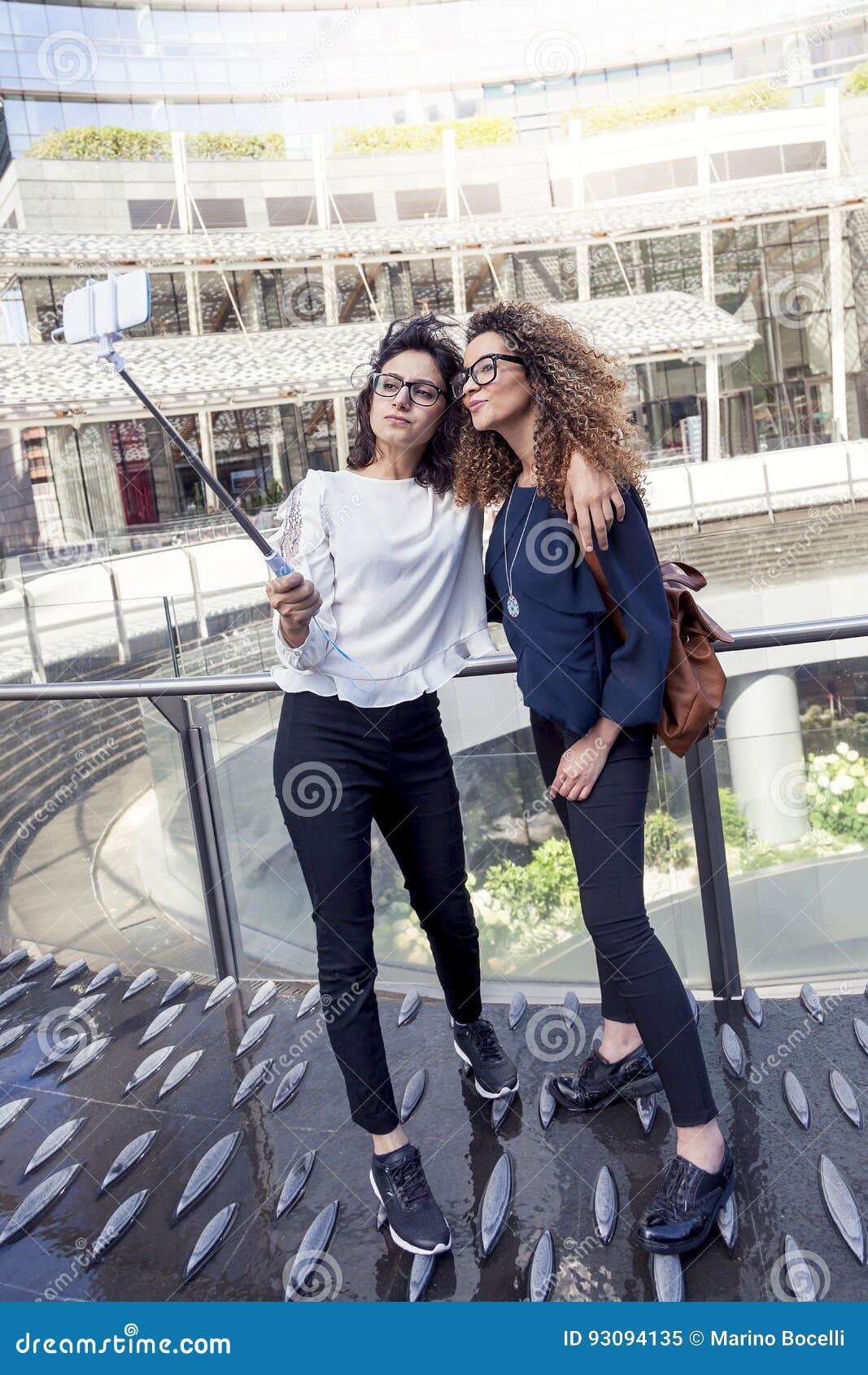 Two Smiling Lovely Girls Takes a Selfie with Smartphone Stock Image ...