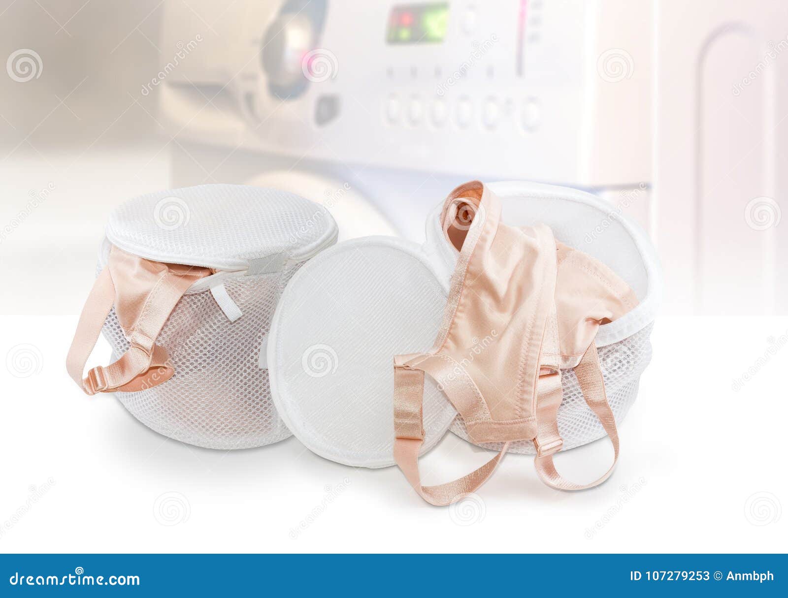 Two Laundry Bags Bras on Blurred Background of Washing Machine