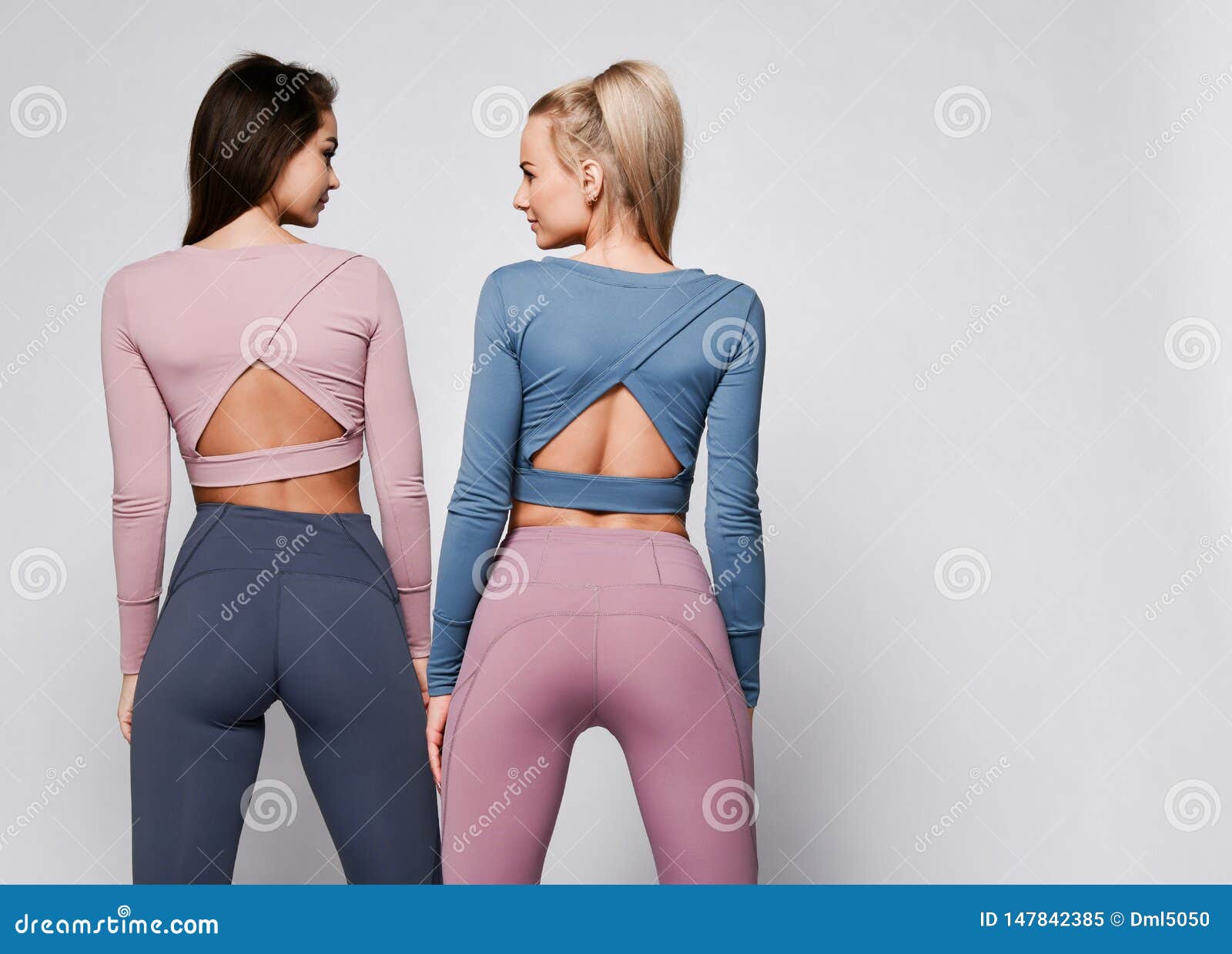 Two Sporty Blonde and Brunette Girls in Athletic Body Cloth Sport Wear Cloth  Stand Together after Workout on Gray Stock Image - Image of lifestyle,  pink: 147842385