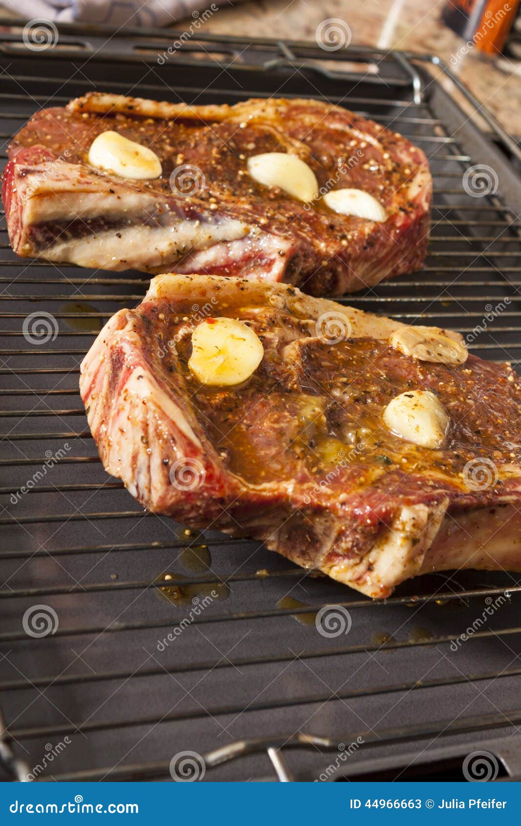 Two Steaks Marinated with Oil and Garlic on Grill Stock Image Image