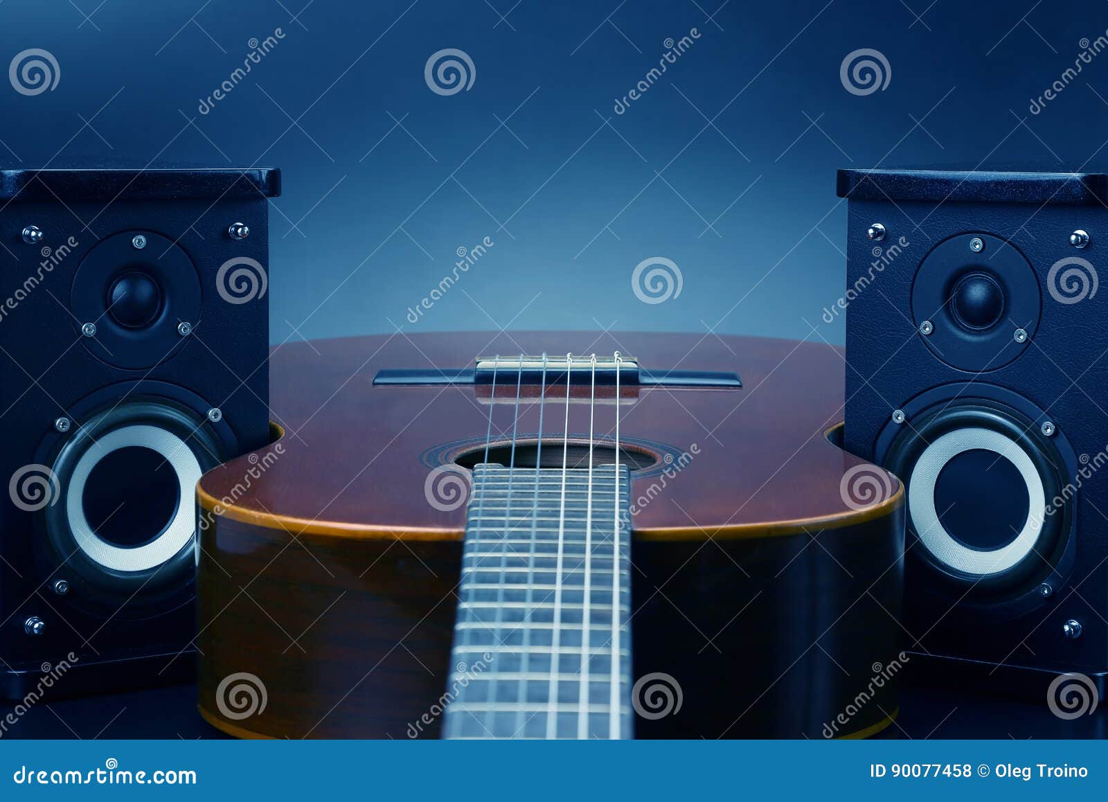 Two Stereo Audio Speakers and Classical Acoustic Guitar Stock Photo