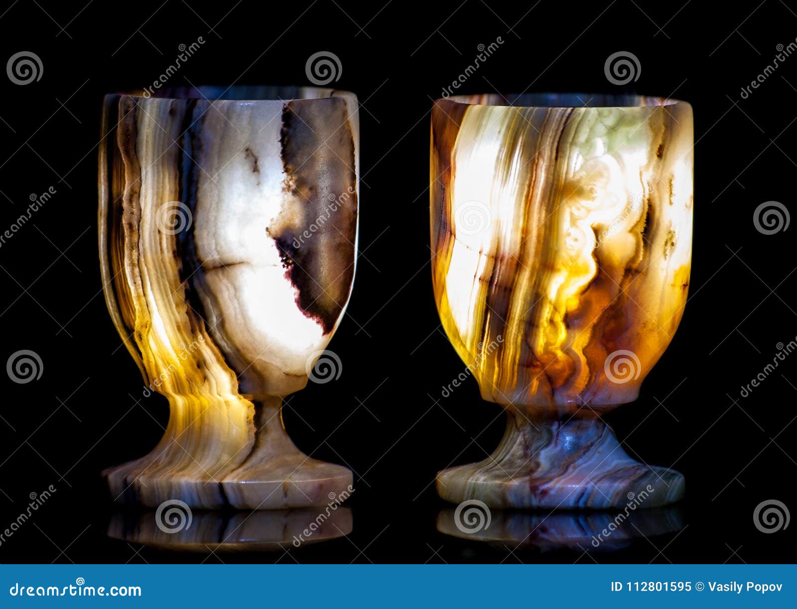 Two Stone Glasses Glow from the Inside in Different Colors Stock Image