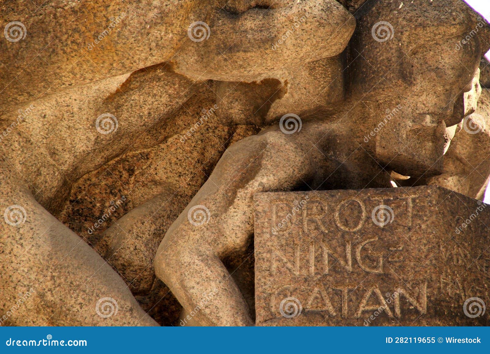 Two Stone Statues of a Woman and a Boy on the Head of One Another Stock