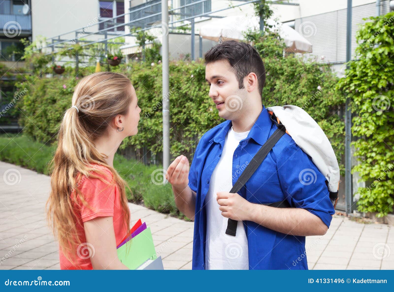 two students on campus speaking about the studies