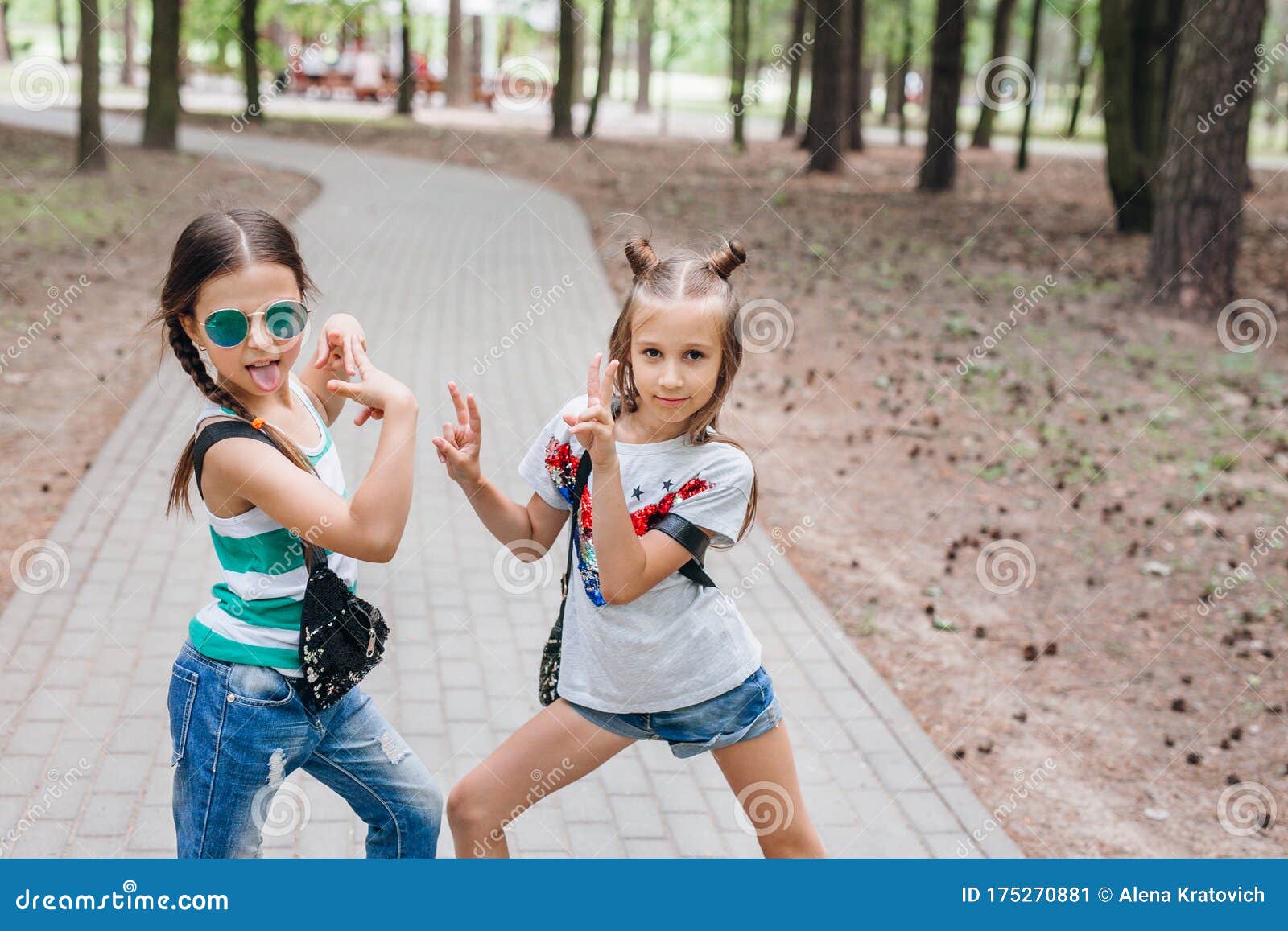 Two Stylish Little Girls In Sunglasses Having Fun Outdoor Stock Image