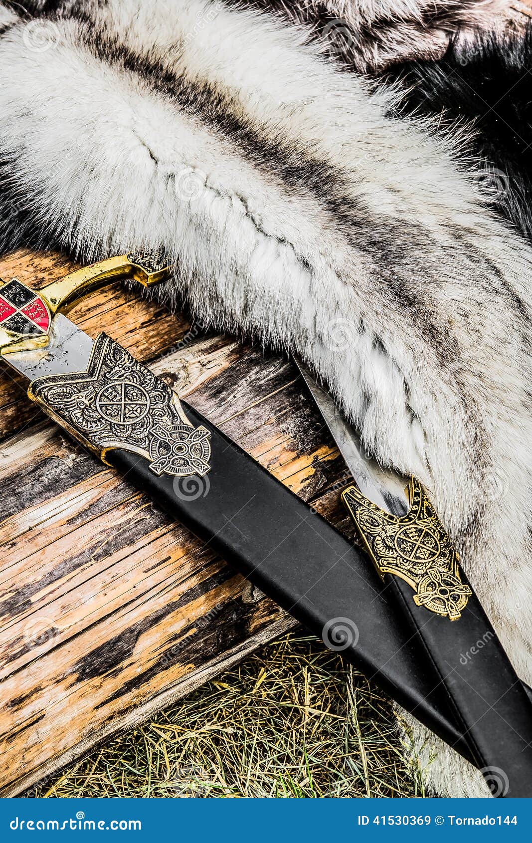 two swords and some furs over the old log