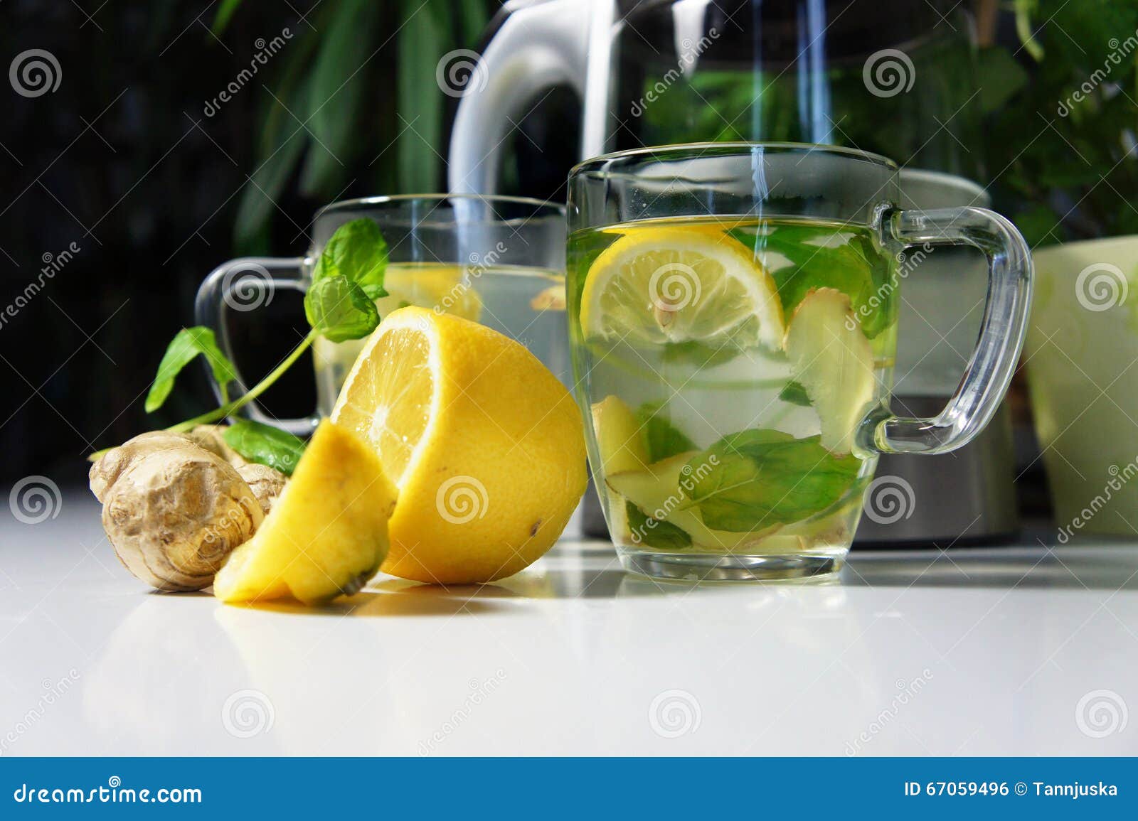 Two Teacups with Fresh Peppermint, Ginger and Lemon Stock Photo Image