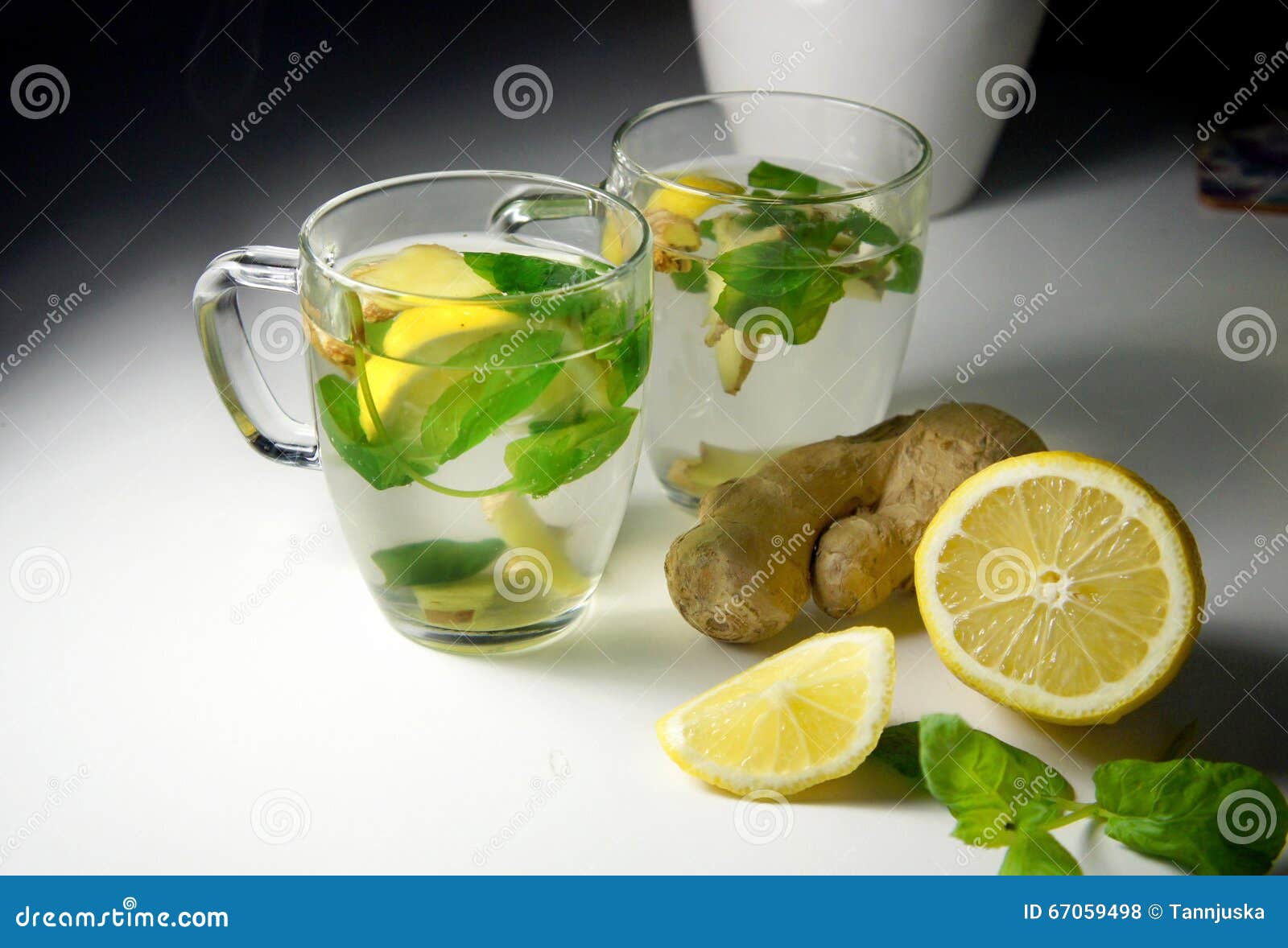 Two Teacups with Fresh Peppermint, Ginger and Lemon Stock Photo Image