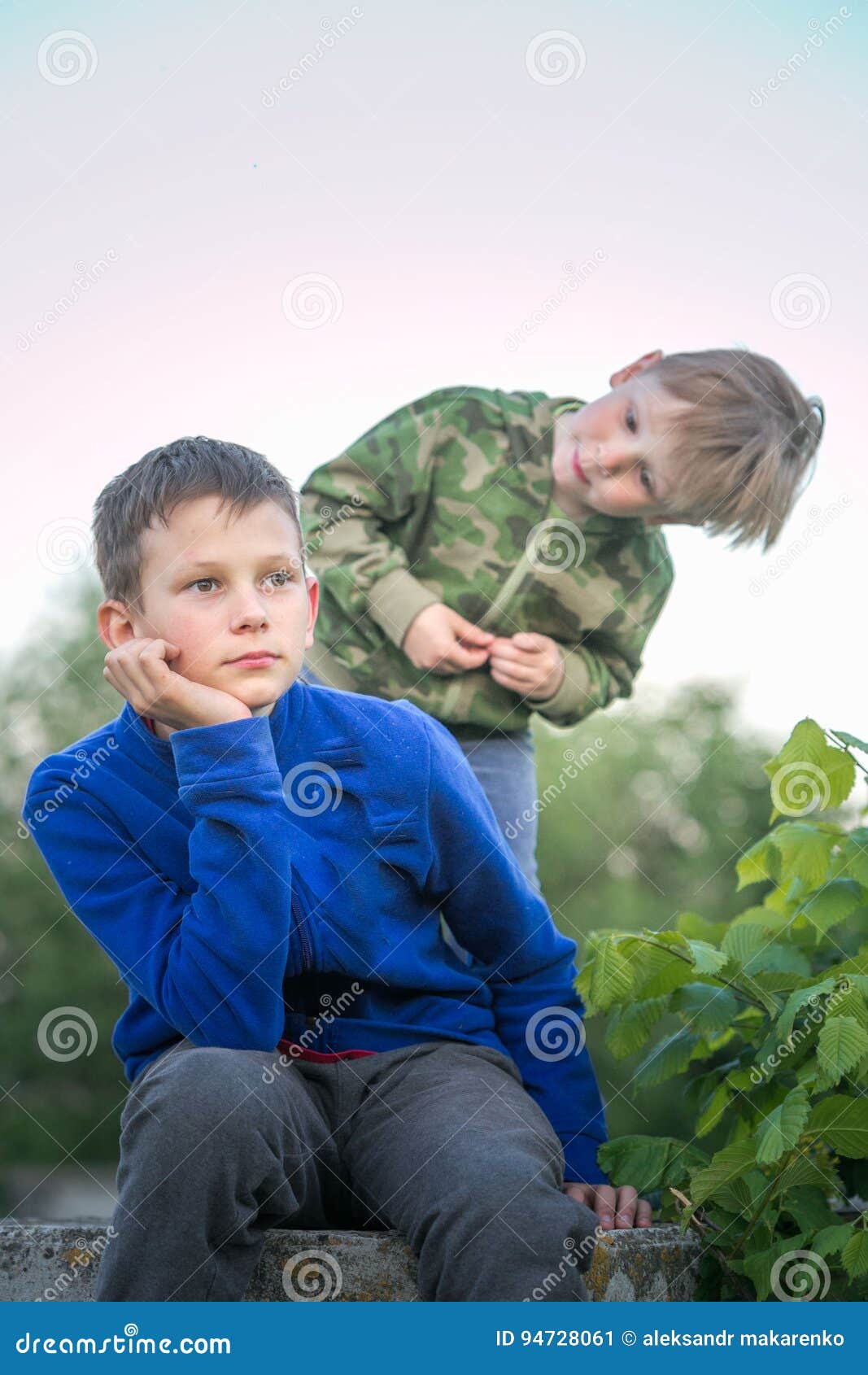 Two Teen Boys Dream in the Evening. Stock Image Image of color
