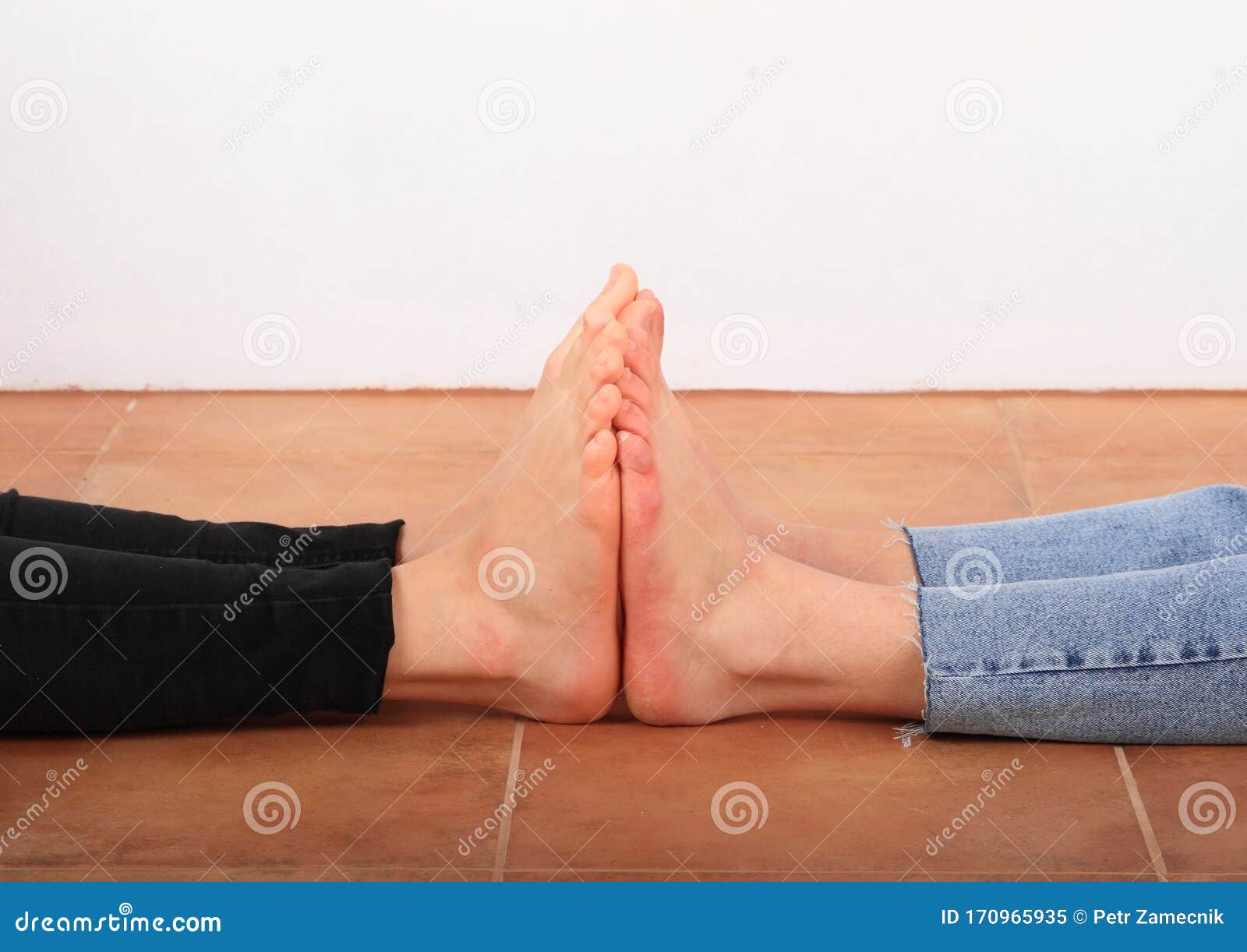 Feet touching on floor stock image. Image of barefeet 170965935