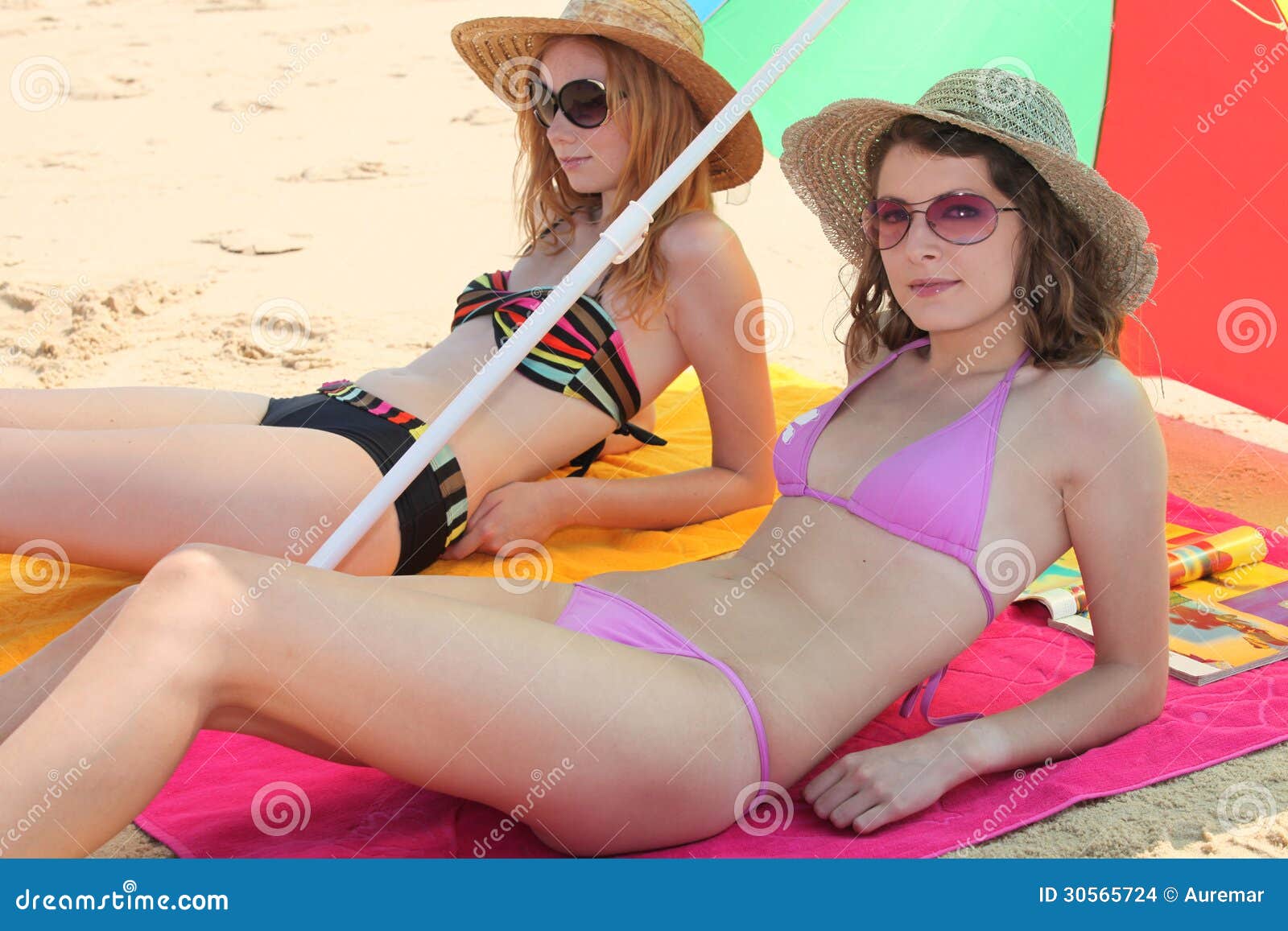 Two Teenage Girls Sunbathing Stock Photos