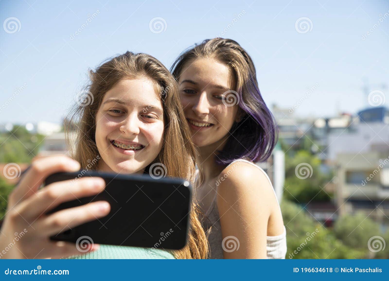 Two Teenage Girls Taking Selfie with a Mobile Phone Stock Photo - Image ...
