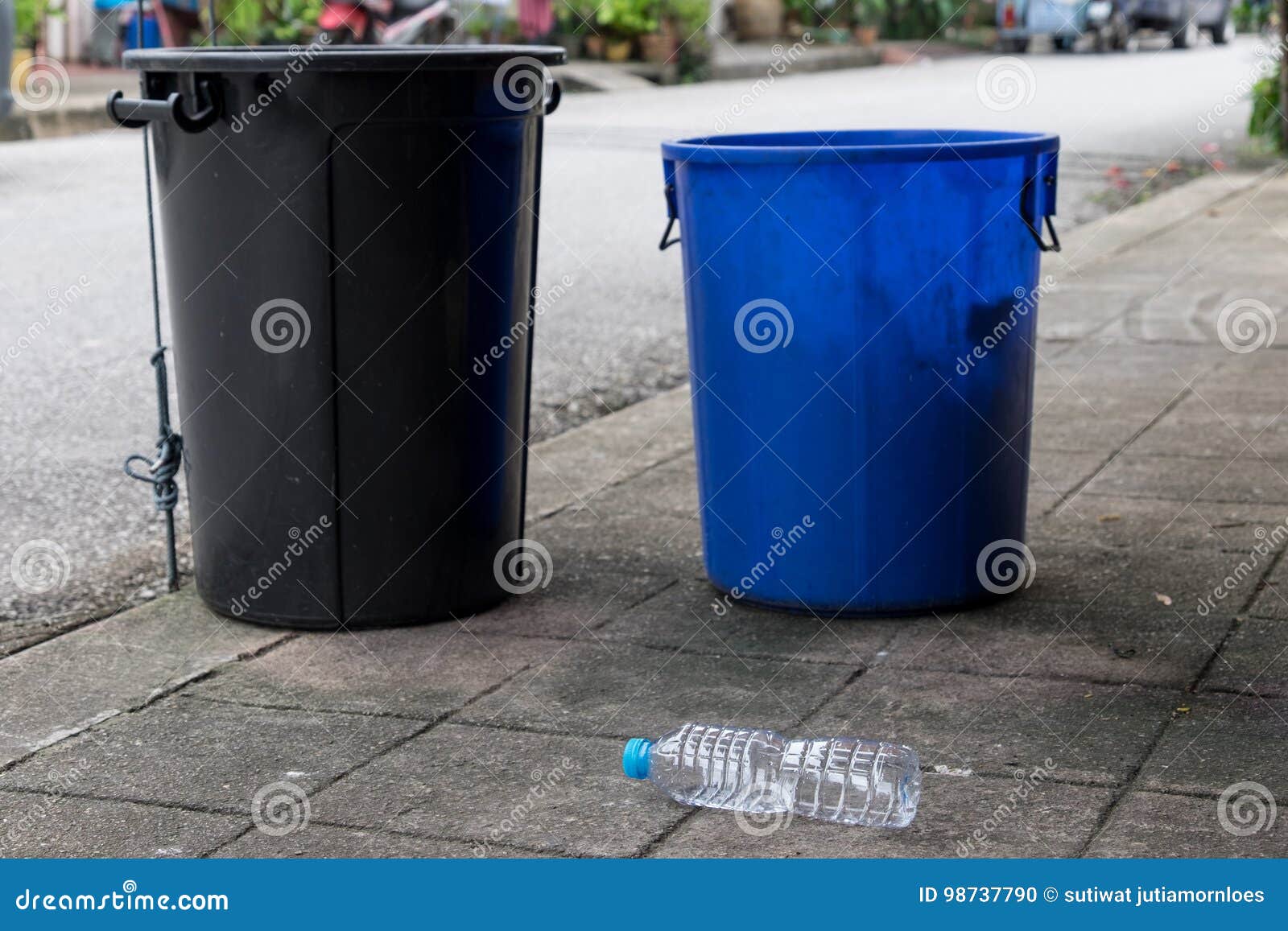 Two Trash Cans Were Placed and a Bottle of Drinking Water Was Left