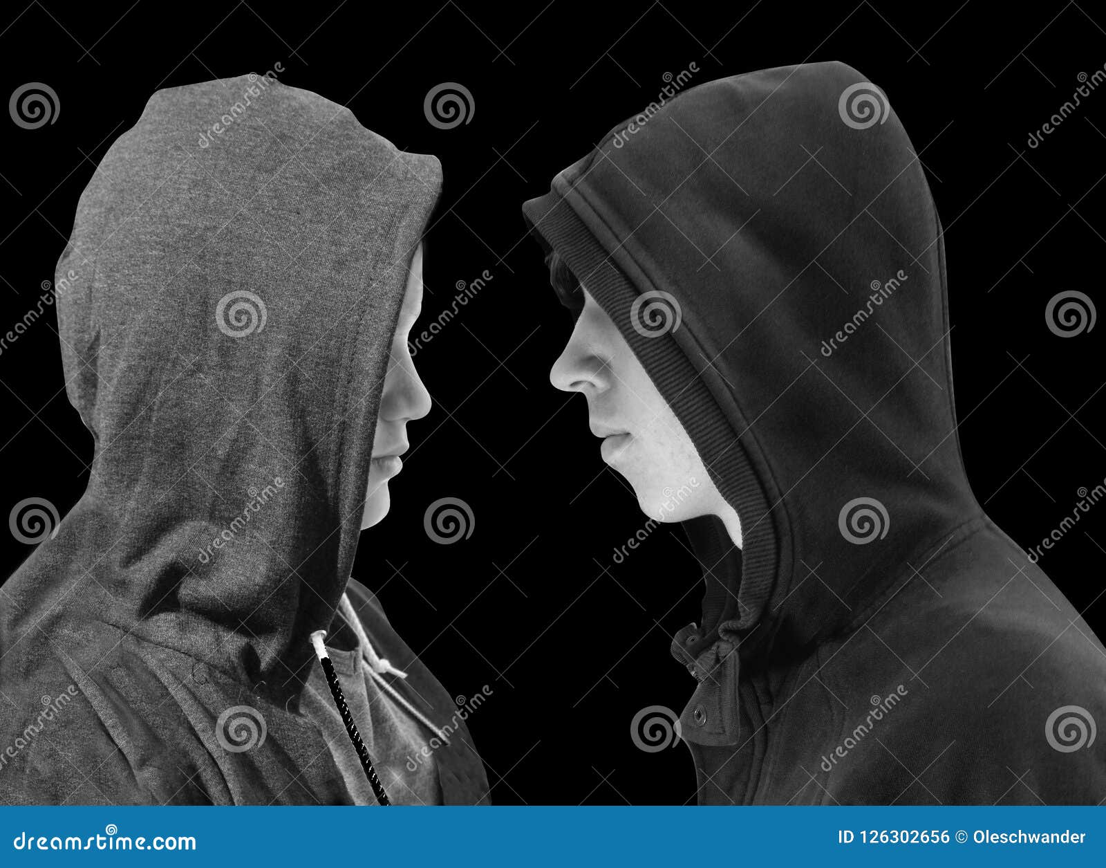 Two Troubled Teenage Boys With Black Hoodie Standing In Front Of Each ...