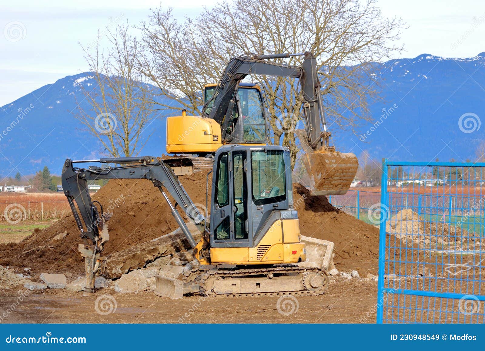 Two Types of Excavators on the Job Stock Image Image of machinery
