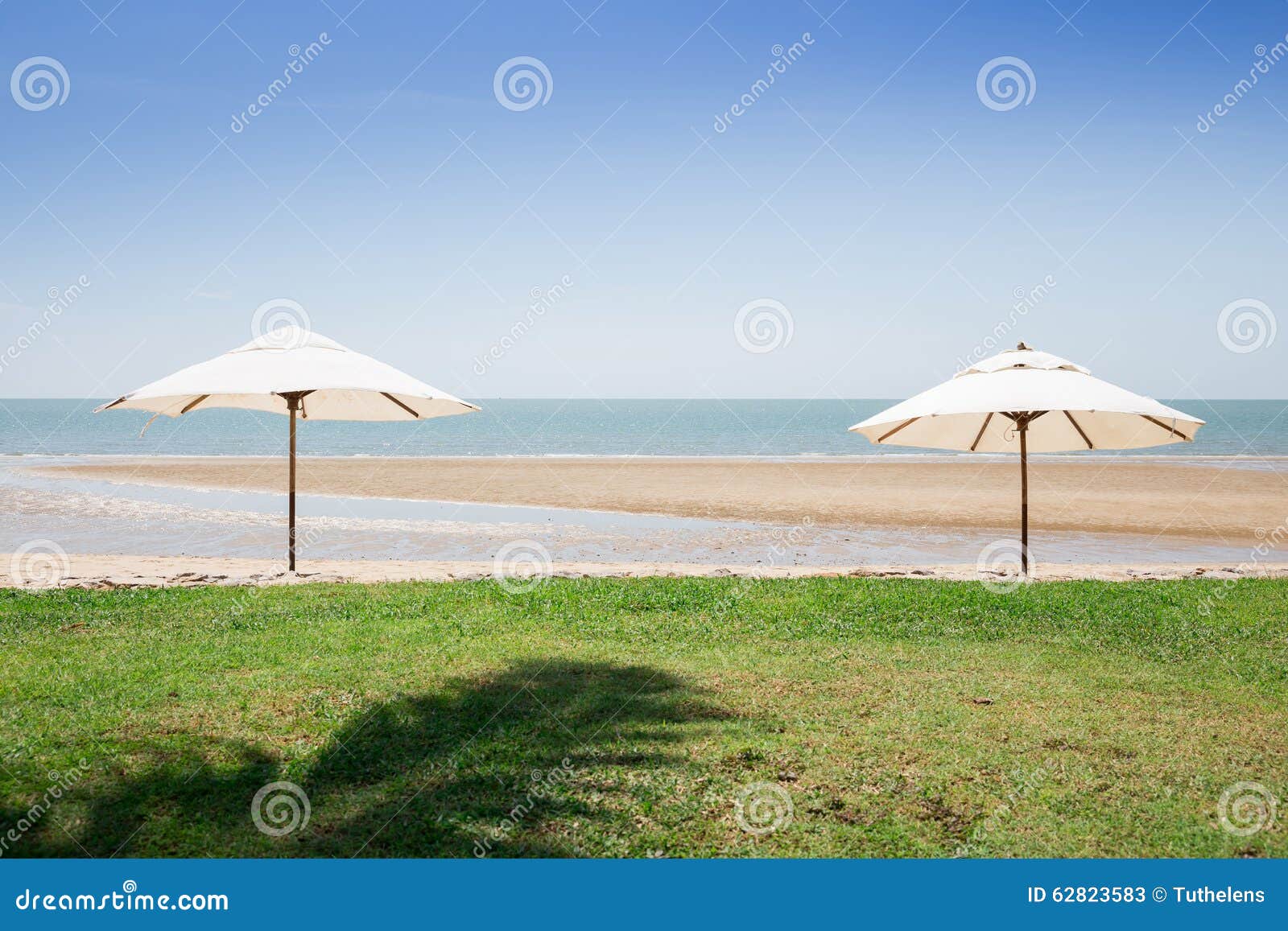 Two Umbrellas on the Beach stock image. Image of beach 62823583