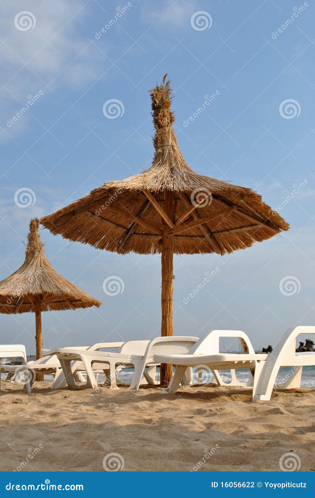 Two umbrellas in the sun stock photo. Image of pool, straw 16056622