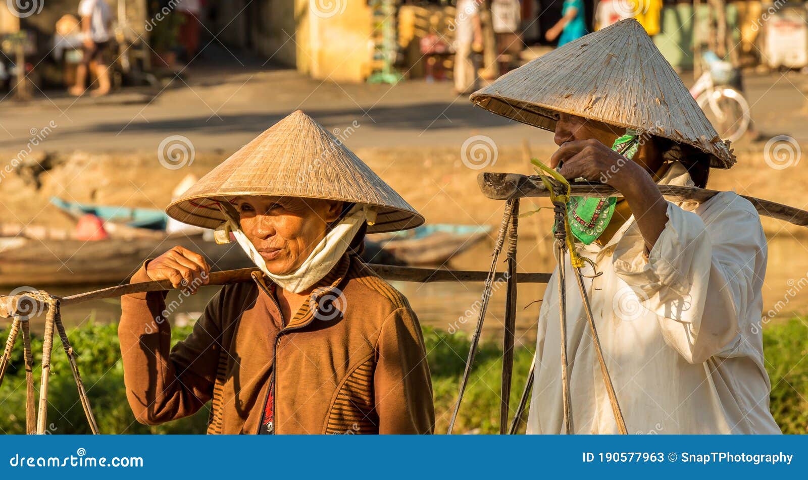 Two Vietnamese Women with Conical Hats ...