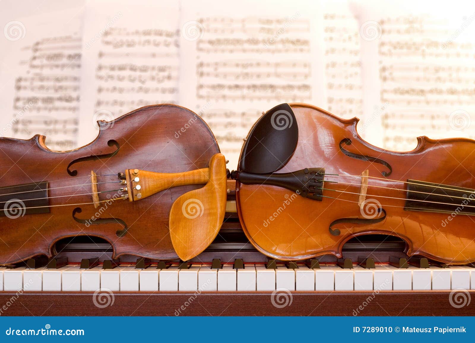 Two violins on piano keys stock photo. Image of chamber 7289010