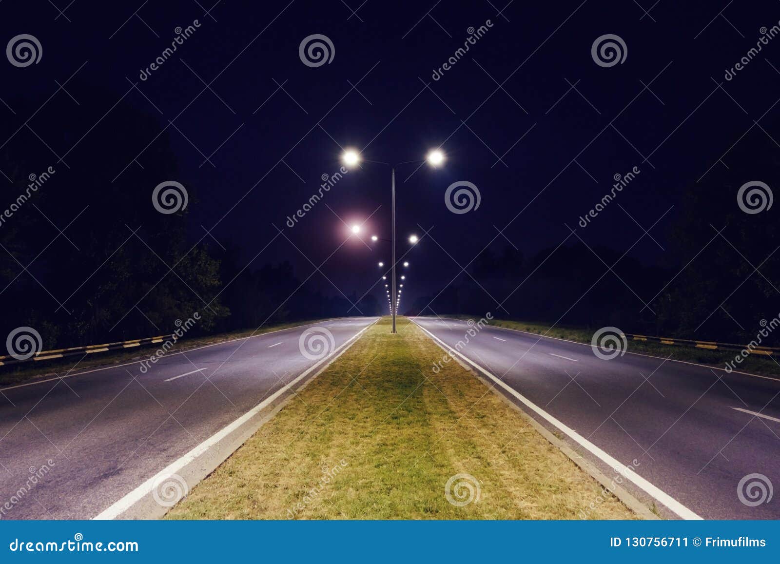 A Two Way Road is Illuminated by the Light Post Stock Image Image of