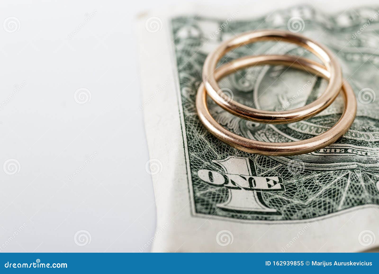 Two Wedding  Rings  And Currency Wedding  Or Divorce  Concept 