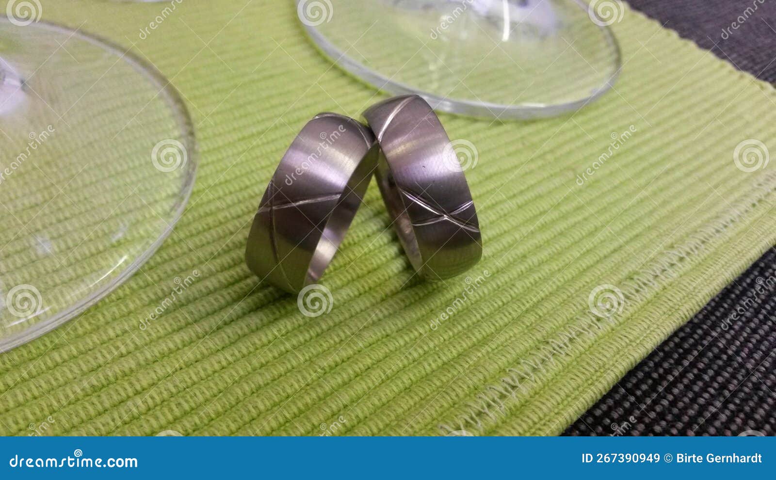 Two Wedding Rings in Front of Two Champagne Flutes Stock Image Image