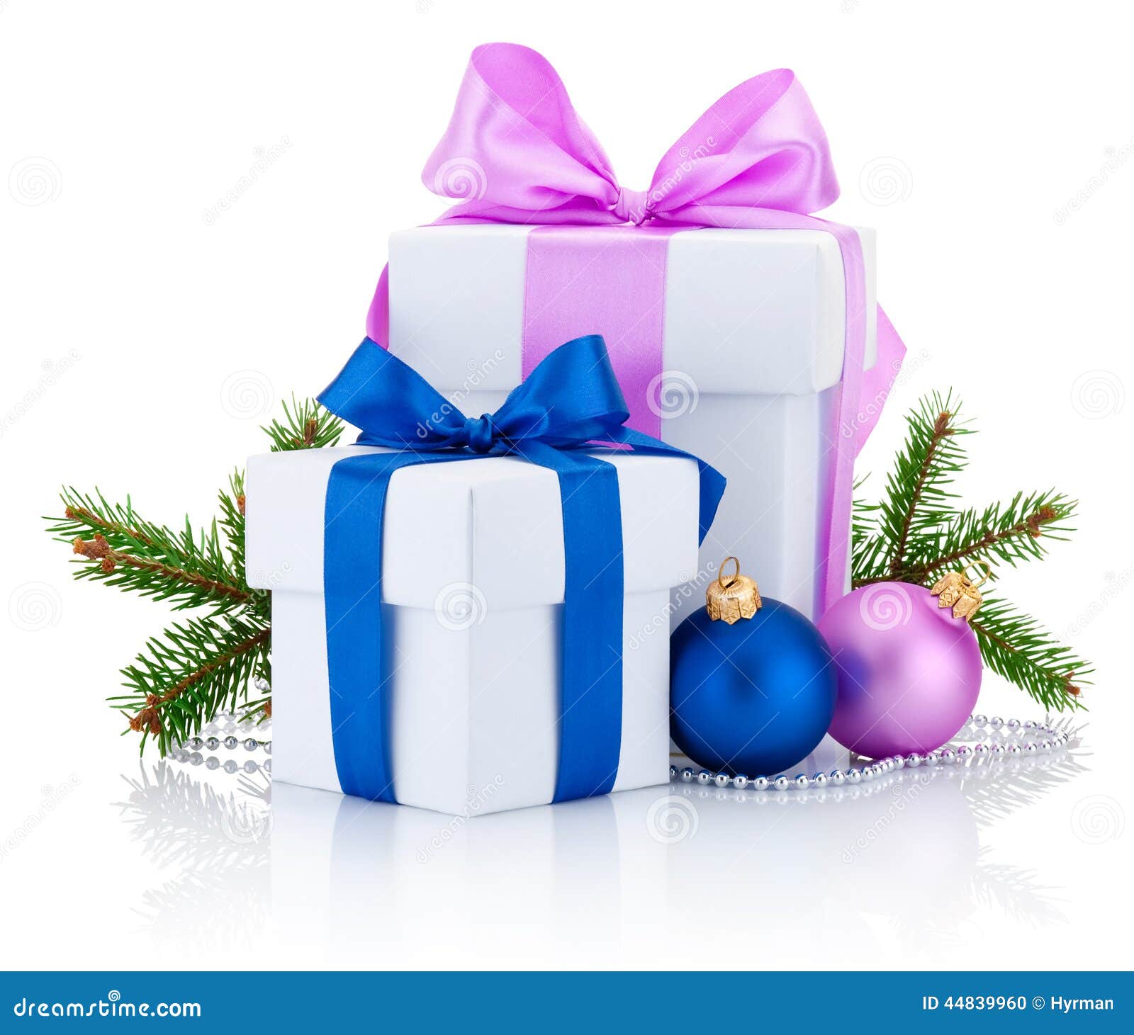 two white boxs tied pink and blue ribbon bow, pine tree branch and christmas balls  on white