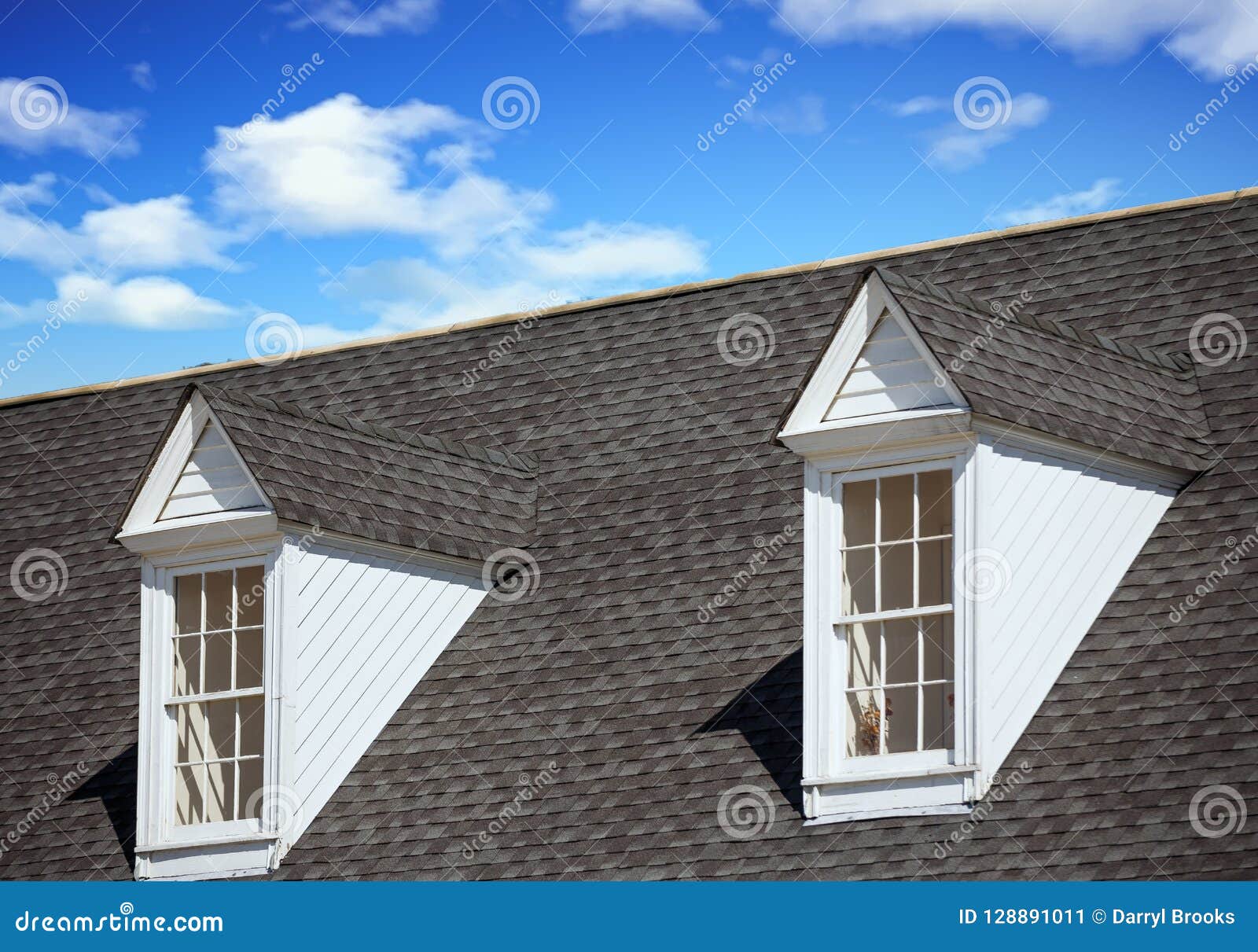 two white dormers on grey shingle roof
