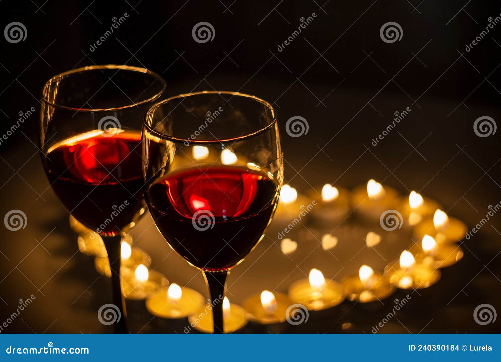 Two Wine Glasses Next To a Heart of Candles Stock Photo Image of evening, night 240390184