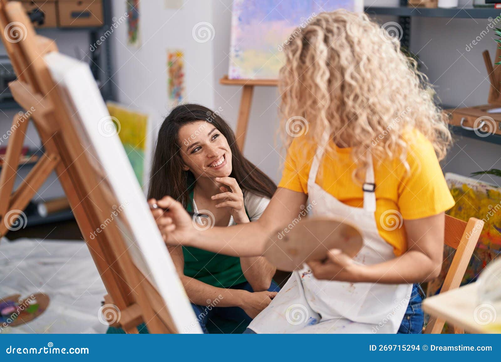 Two Women Artists Smiling Confident Drawing at Art Studio Stock Photo