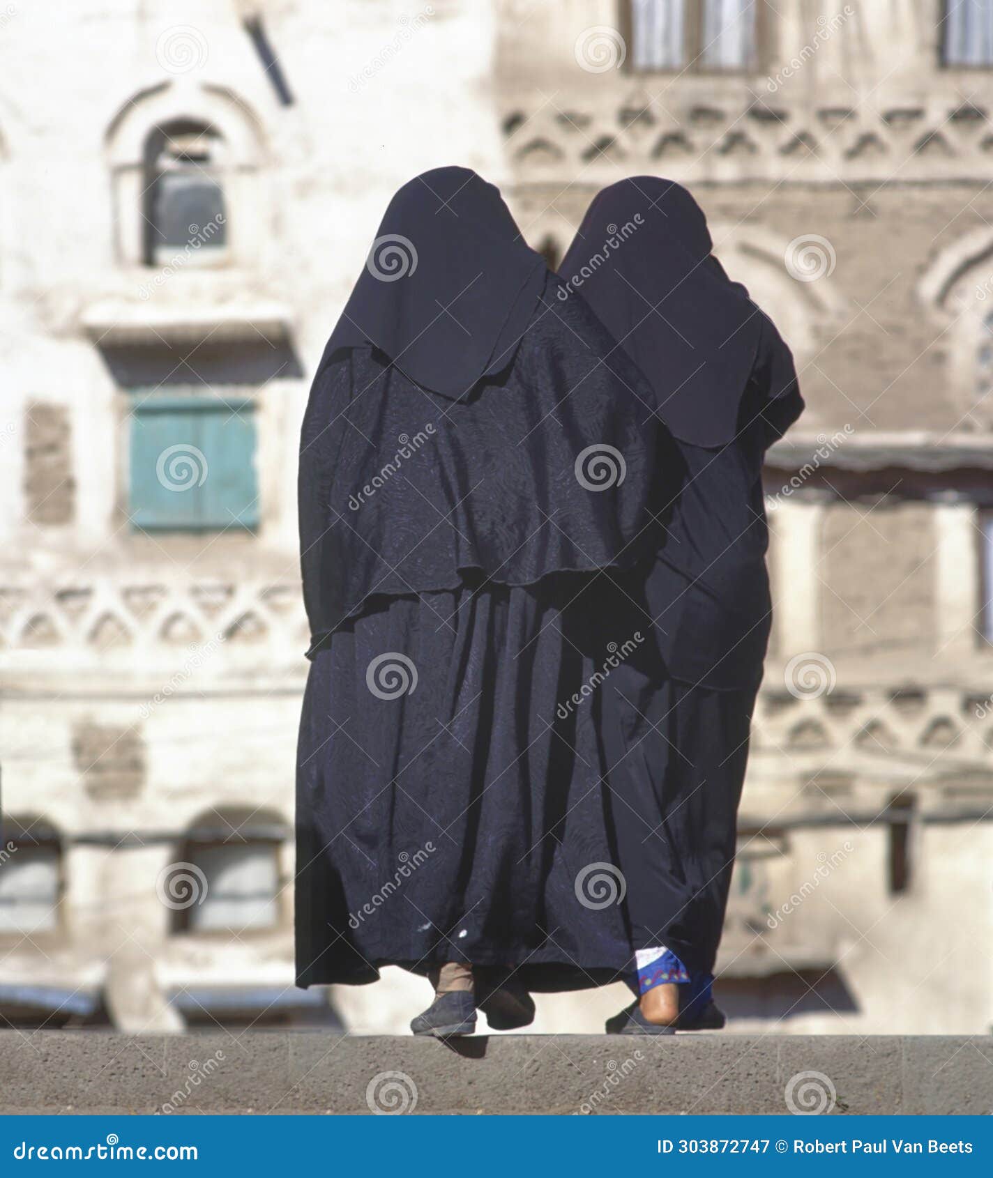 two women in a black burka