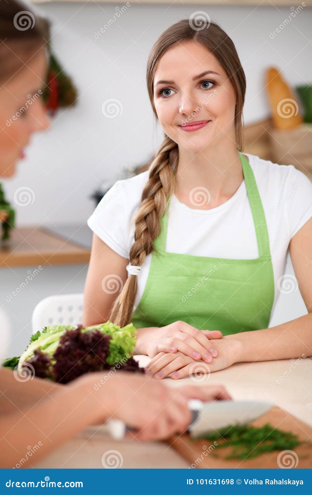 Two Women Is Cooking In A Kitchen Friends Having A