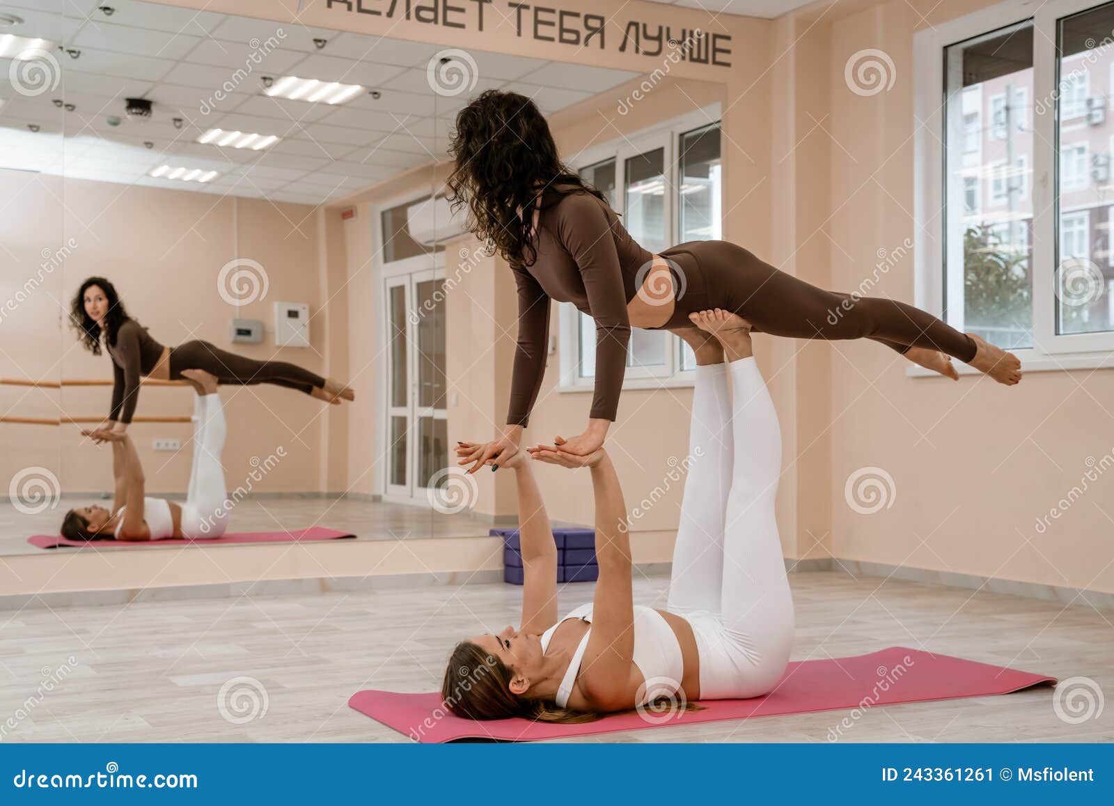 https://thumbs.dreamstime.com/z/two-women-do-acroyoga-light-floor-near-large-mirror-yoga-studio-wearing-leggings-tops-two-women-do-243361261.jpg