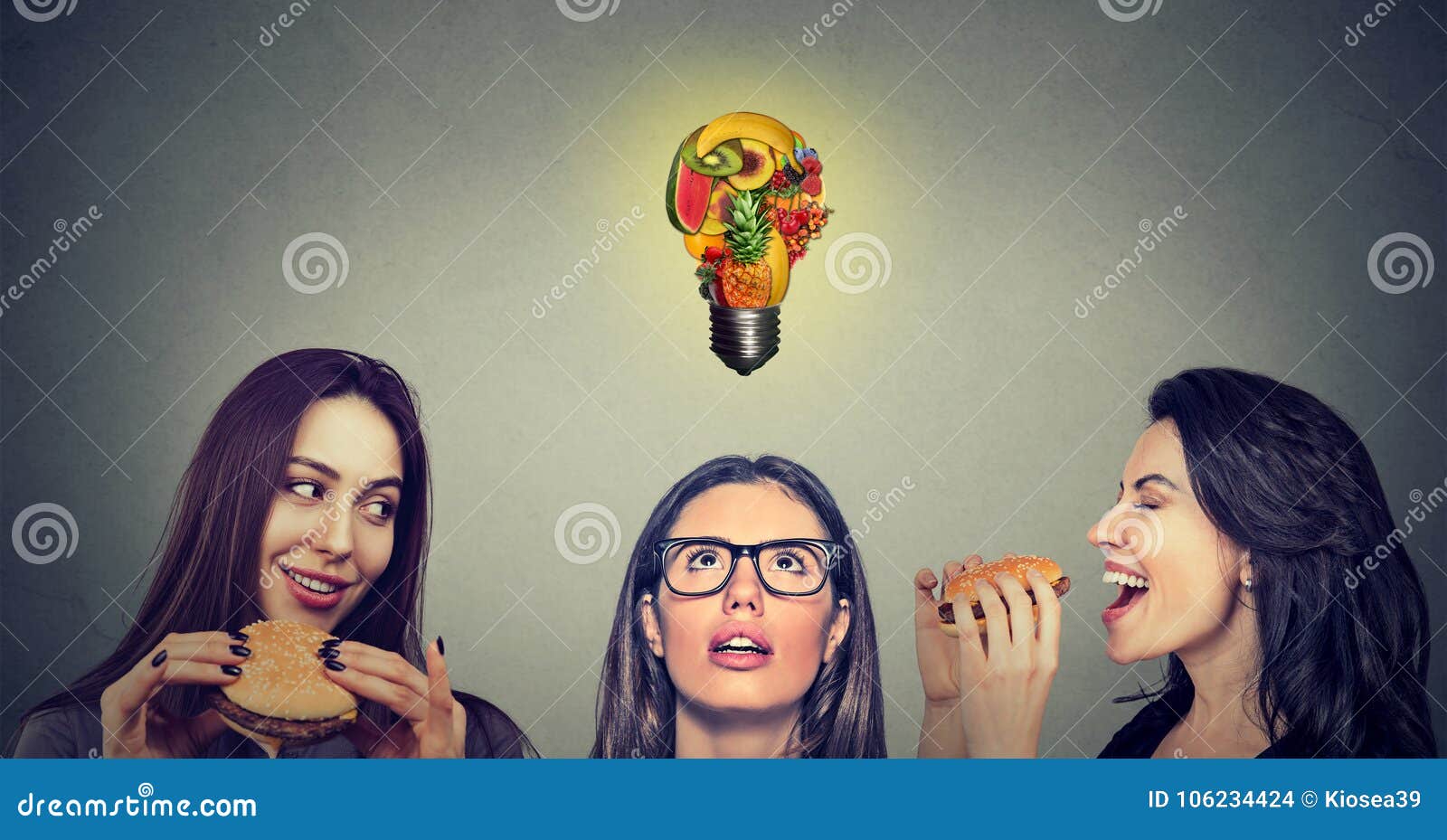 two young women eating hamburgers looking at stressed thoughtful