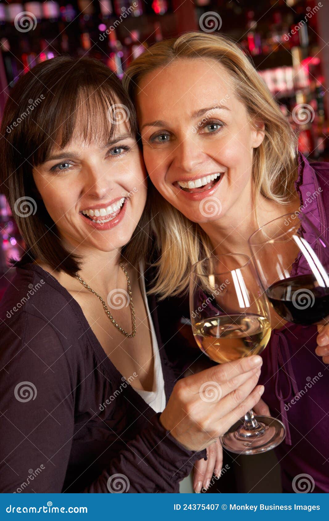 Two Women Enjoying Drink Together in Bar Stock Image Image of night