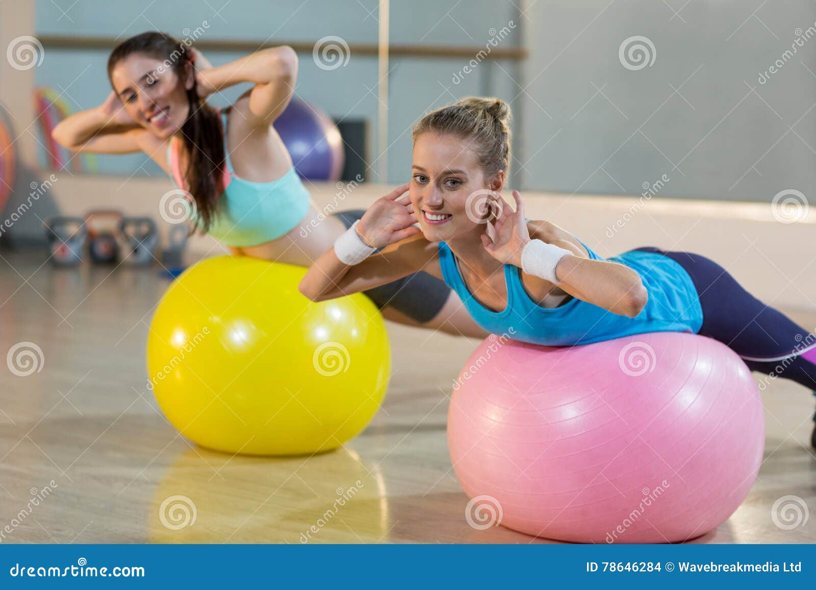 Two Women Exercising On Exercise Ball Stock Photo Image Of Smiling