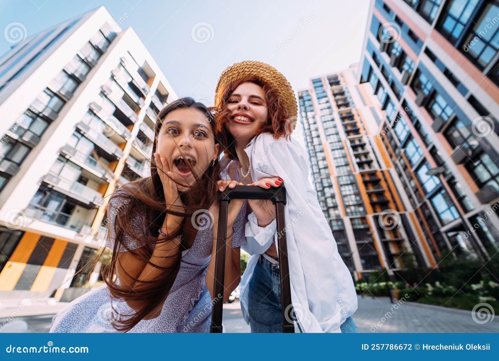 Two Women Are Looking At The Camera Stock Photo Image Of City how-to-read-a-text-file-and-store-it-in-an-array-in-java-linux-consultant