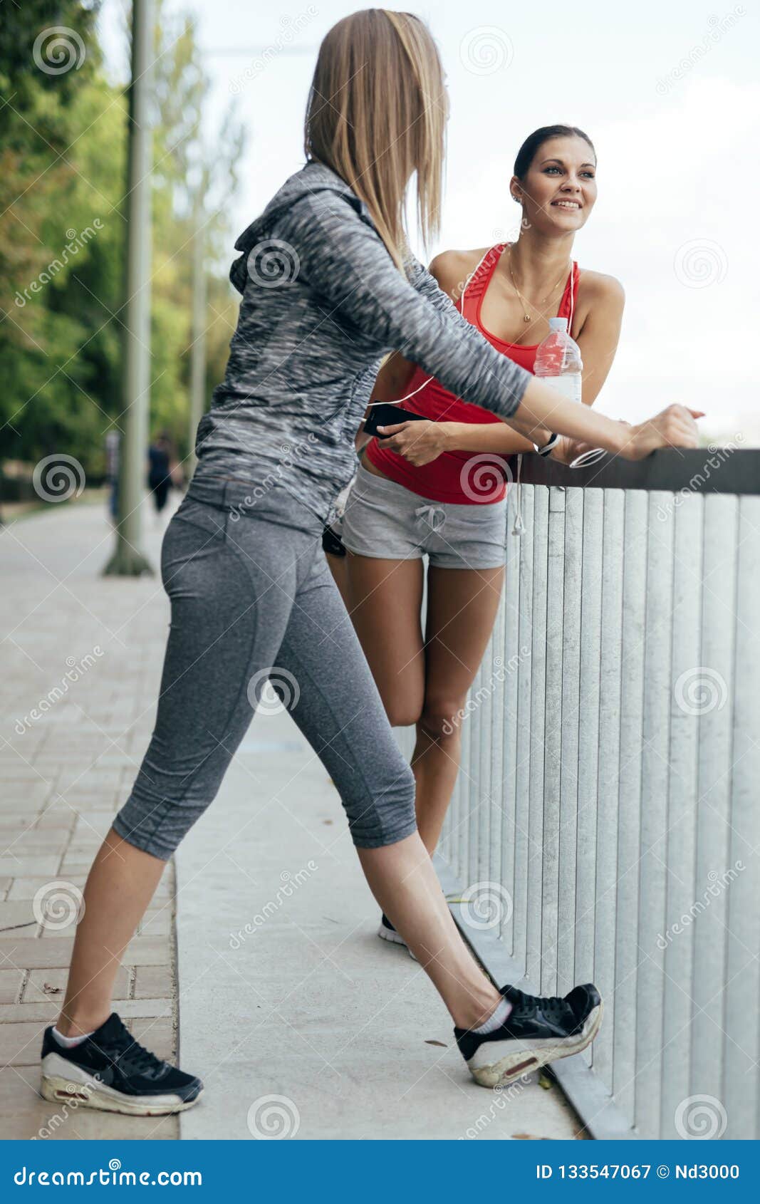 Two Women Stretching Before Jogging Stock Image Image Of Girl 