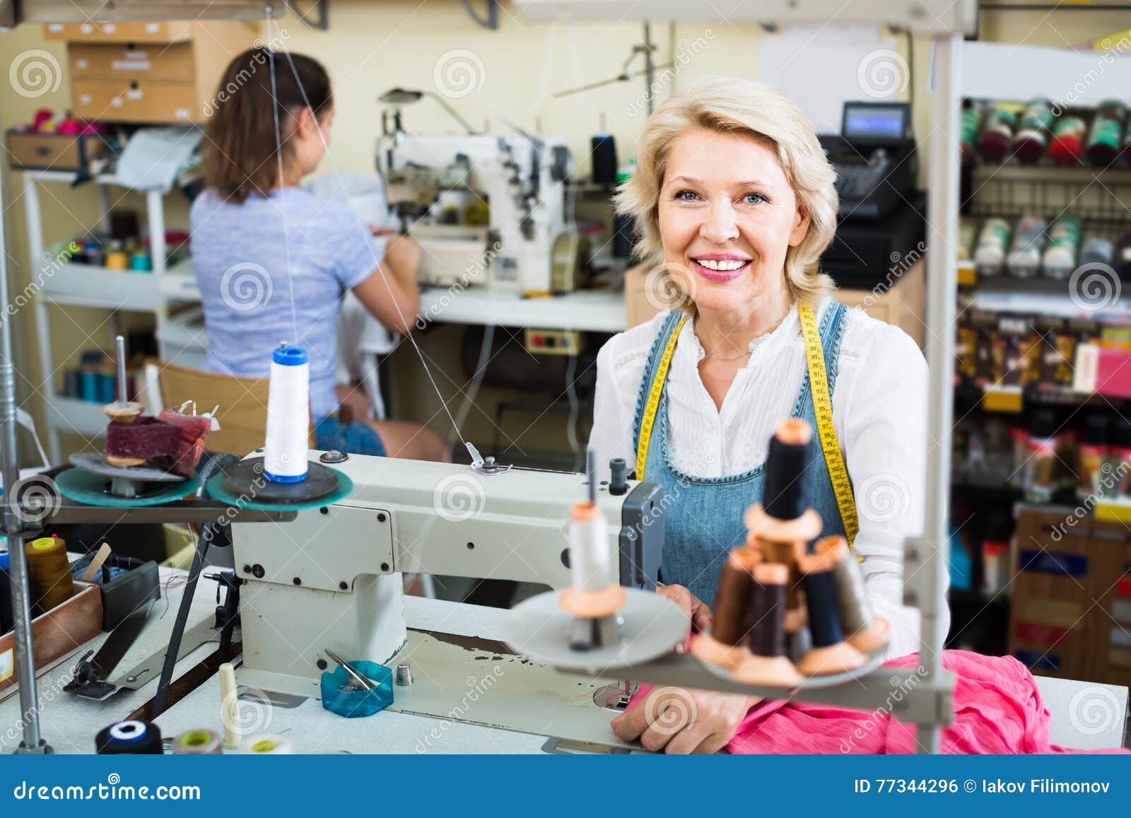 Two Women Tailors Different Ages Working with Sewing Machines Stock