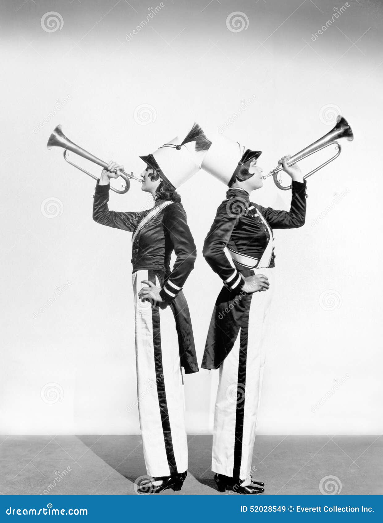 two women in a toy soldier uniforms with trumpets