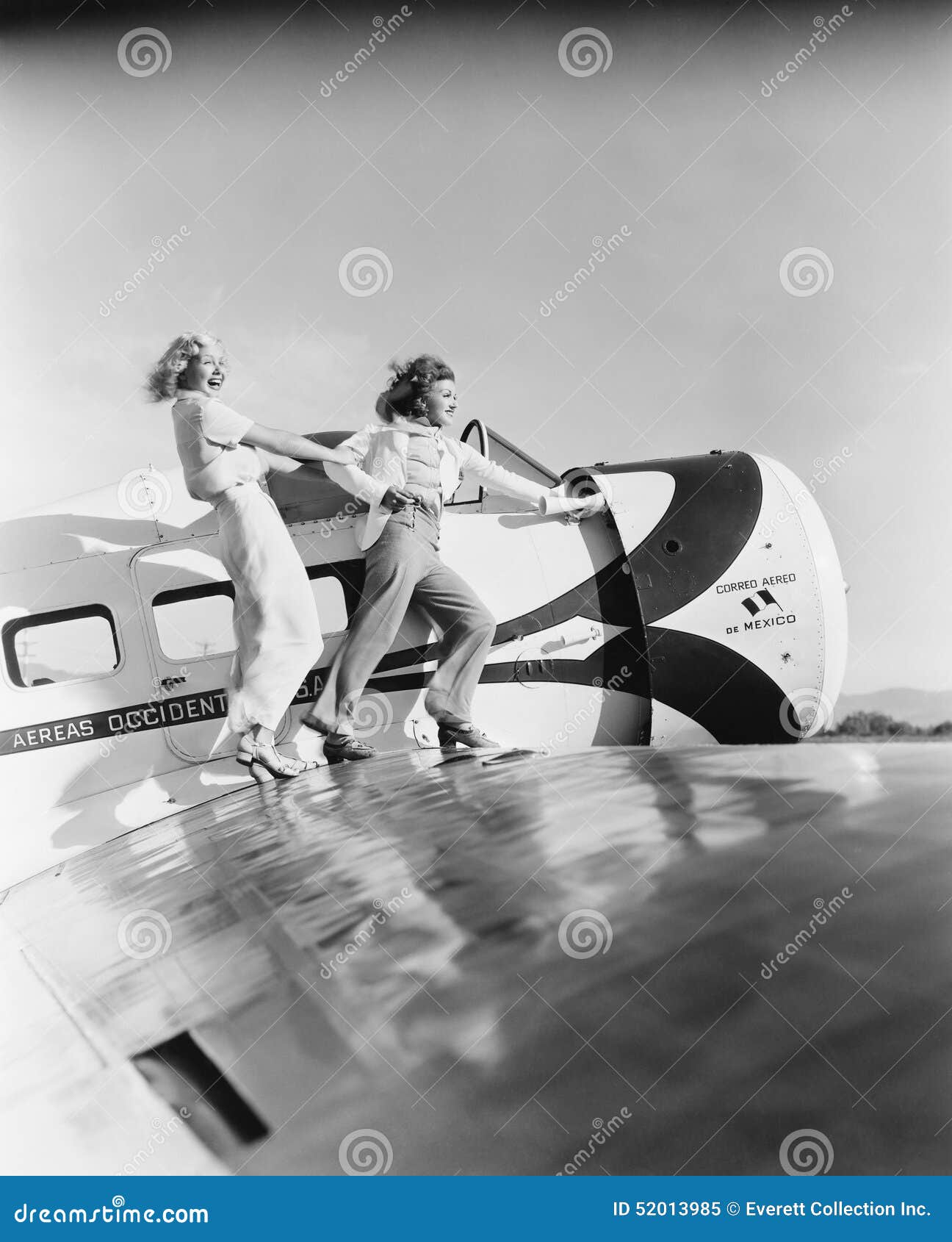 Two Women Walking on the Wing of a Plane Stock Image Image of delight