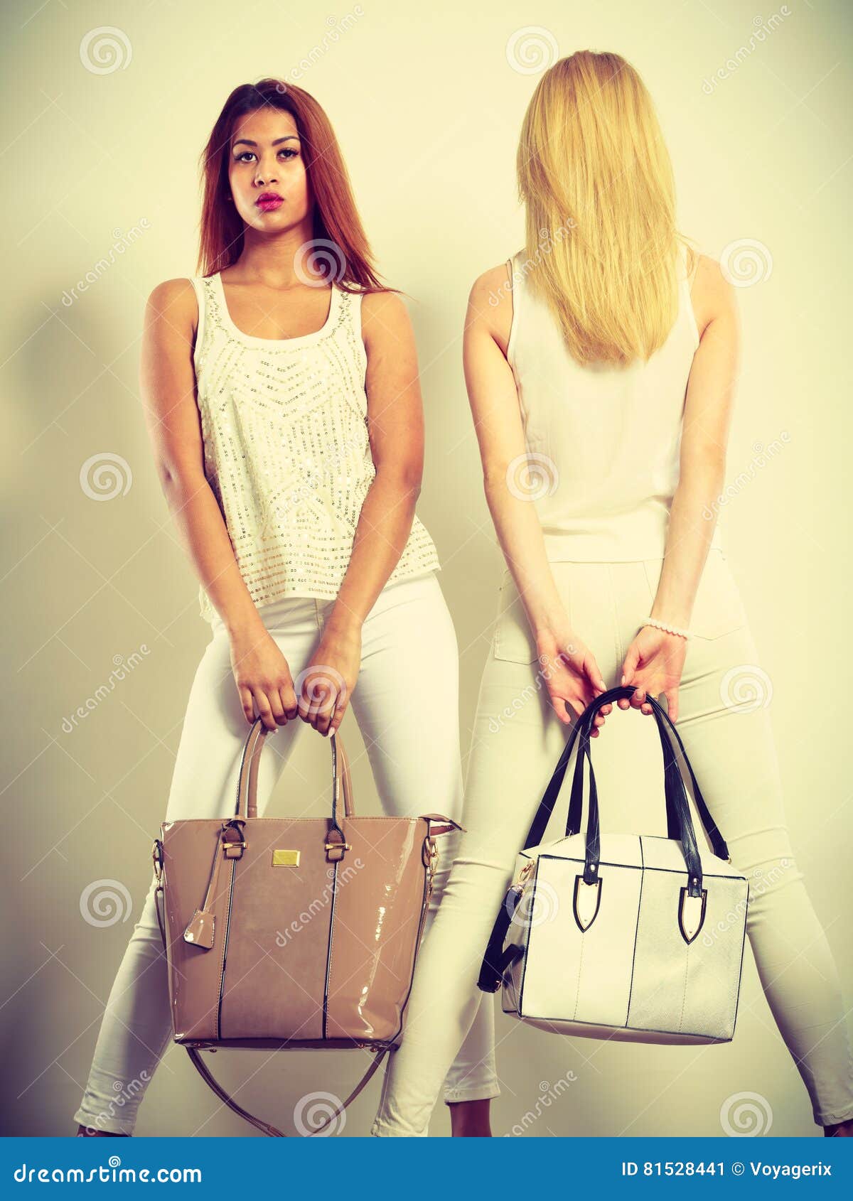 Two Women in White Clothes with Bags Handbags. Stock Image - Image of ...